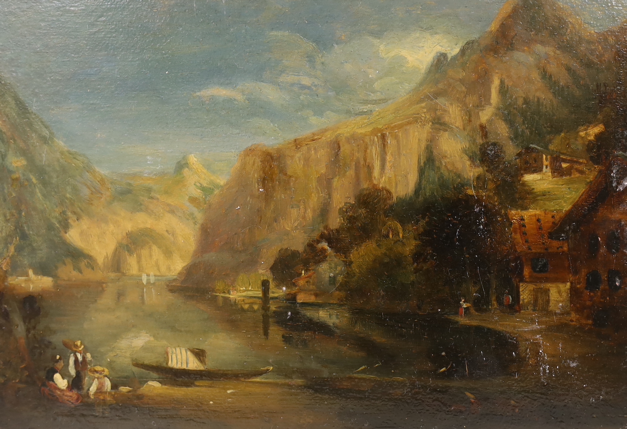 19th century Continental School, oil on board, mountainous landscape with figures before a lake, unframed, 25.5cm x 18cm
